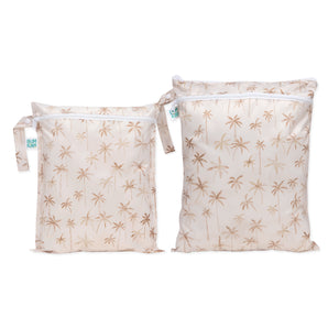 The Bumkins Wet Bag + Wet/Dry Bag Set: Palm Daze—stylish, reusable travel essentials with handles and blue tags.