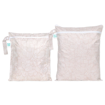 Bumkins Wet Bag + Wet/Dry Bag Set: Wander—2 beige waterproof bags with white abstract patterns and zipper closures.