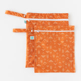 Bumkins Wet Bag + Wet/Dry Bag Set: Grounded lays overlapped on a white background.