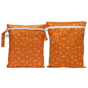 Bumkins Wet Bag + Wet/Dry Bag Set: Grounded—orange, white arrow print, eco-friendly packing essentials with side straps.