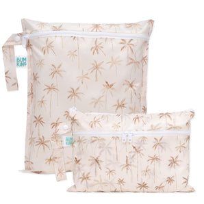 Bumkins Wet Bag + Wet/Dry Clutch Set: Palm Daze includes 2 beige waterproof bags with a palm tree print, zipper closure, and side handle.