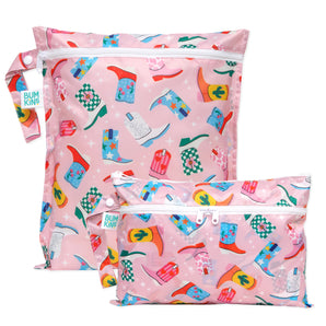 Bumkins Wet Bag + Wet/Dry Clutch Set: Boots includes 2 waterproof pink bags with a cowboy boot design and zippers.
