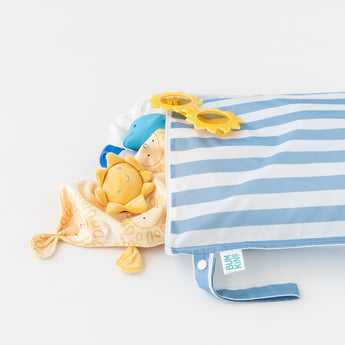 A Bumkins Wet Bag Plus 2 Pack: Blue + Yellow Stripe holds sunglasses stuffed toys, and more on a white background.
