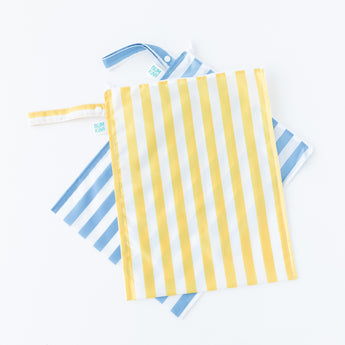 Bumkins Wet Bag Plus 2 Pack: Blue + Yellow Stripe lays stacked on a white background.