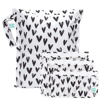 Bumkins The Chaos Coordinator Essential 4-Piece Set: Hearts—4 white waterproof bags with black hearts and zipper closure.