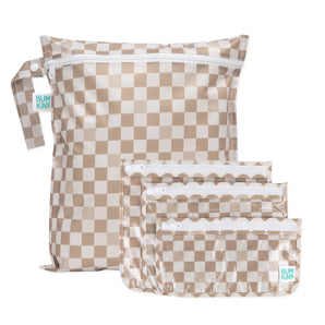 The Bumkins Wet Bag + Clear Travel Bag 3 Pack Set in Sand Check is perfect for travel organization or as a stylish gift.