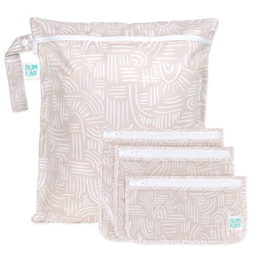 Bumkins Wet Bag + Clear Travel Bag 3 Pack Set: Wander—beige bags with white patterns, perfect for organized travel.
