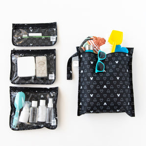 Bumkins The Chaos Coordinator Essential 4-Piece Set: Mickey Mouse Icon Black + White holds beach gear & toiletries on a white background.