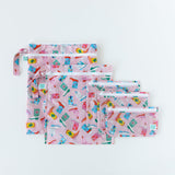 Bumkins Wet/Dry Bag: Boots lays flat on a white background underneath similar bags with a matching pattern.