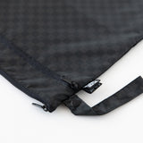 Close-up of Bumkins Wet/Dry Bag: Rich Black, featuring zippered compartments and a side handle, on a white background.