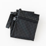 A folded Bumkins Wet/Dry Bag: Rich Black  lays on a white background.