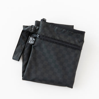 A folded Bumkins Wet/Dry Bag: Rich Black  lays on a white background.