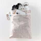 Bumkins Wet/Dry Bag: Wander holds a water bottle, gloves, a notebook, and black shoes on a white background.