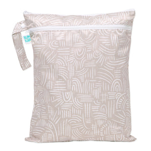 Bumkins Wet/Dry Bag: Wander—beige waterproof fabric with a white abstract design, zipper, and handle.