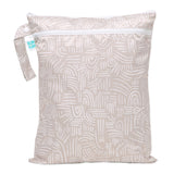 Bumkins Wet/Dry Bag: Wander—beige waterproof fabric with a white abstract design, zipper, and handle.