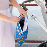 A person opens Bumkins Wet/Dry Bag:  Mickey & Friends Forever attached to a stroller, showcasing its contents.
