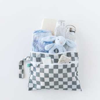 A bag from Bumkins On-The-Go Mealtime 6-Piece Set: Charcoal Check + Grey holds baby essentials on a white background.