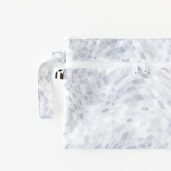 Roamio by Bumkins Wet/Dry Clutch: Disco Check lays flat on a white background.