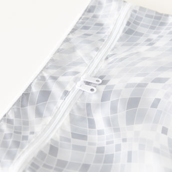 Close-up of Roamio by Bumkins Wet/Dry Clutch: Disco Check on a white background, with focus on the dual zipper.