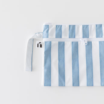 Roamio by Bumkins Wet/Dry Clutch: Nautical Stripe lays flat on a white background.