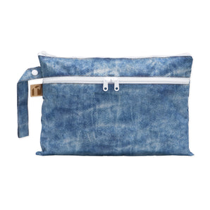 Roamio by Bumkins Wet/Dry Clutch: Crushed Denim is a zippered pouch with two compartments made of blue denim printed waterproof fabric.
