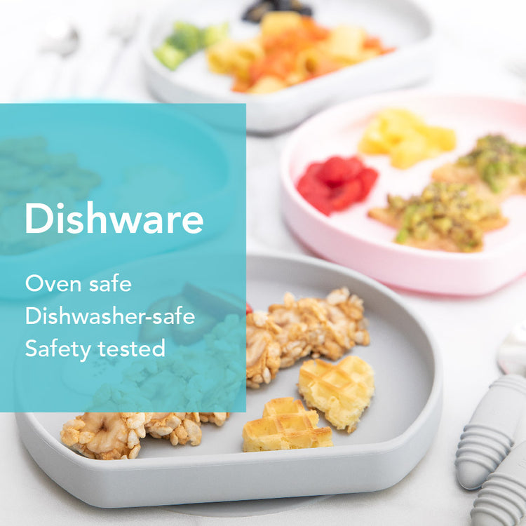 Plates with sections filled with various foods, including waffles and snacks, are displayed. A turquoise overlay reads: Dishware. Oven safe, Dishwasher-safe, Safety tested. The background shows utensils and more colorful plates.