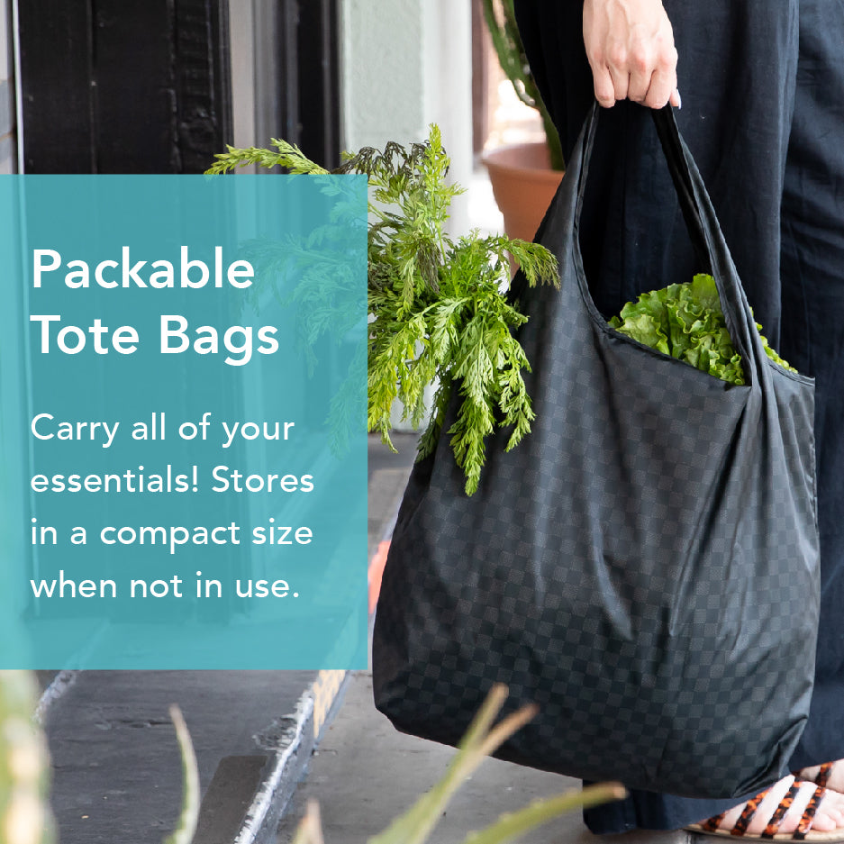 A person carrying a black checkered tote bag full of greenery, walking on a sidewalk. Text on the image reads, Packable Tote Bags. Carry all of your essentials! Stores in a compact size when not in use.