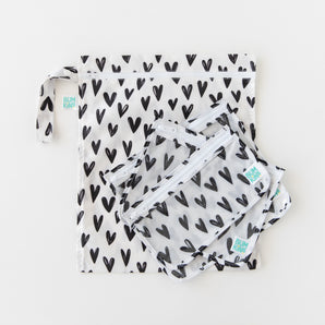 Bumkins Wet Bag + Clear Travel Bag 3 Pack Set: Hearts—stylish, reusable bags for organized travel and busy parents.