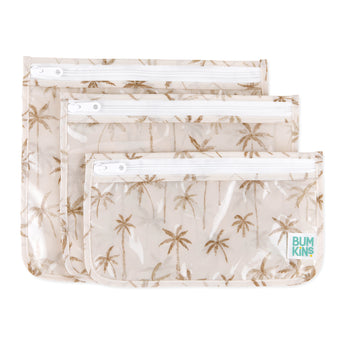Bumkins Clear Travel Bag 3 Pack: Palm Daze includes three waterproof, TSA-compliant pouches with white zippers and a palm tree print.