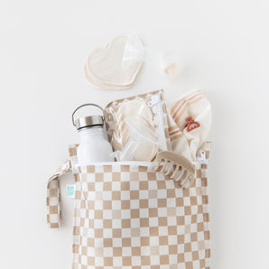 Bumkins Wet Bag + Clear Travel Bag 3 Pack Set in Sand Check holds essentials for travel, fits wet bag, nursing pads, and more.