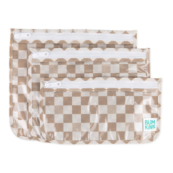 Bumkins Clear Travel Bag 3 Pack: Sand Check includes three TSA-compliant pouches with a beige checkered pattern, and white zippers.