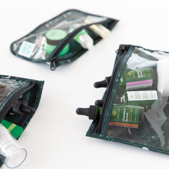 Bumkins Clear Travel Bag 3 Pack: Starry Cactus with skincare products are neatly arranged on a white background.