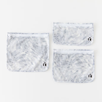 Roamio by Bumkins Clear Travel Bag 3 Pack: Disco Check is neatly arranged on a white background.