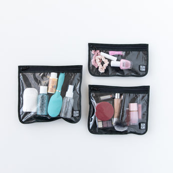 Bumkins Clear Travel Bag 3 Pack: Rich Black holds toiletries and makeup while displayed on a white background.