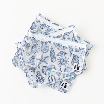 3 bags from Roamio by Bumkins The Commuter Essential 4-Piece Set: Shells lay stacked on a white background.
