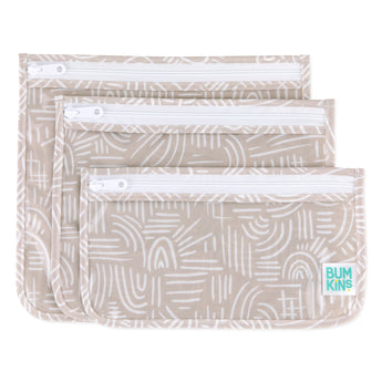 Bumkins Clear Travel Bag 3-Pack: Wander includes three pouches with a white abstract pattern on beige waterproof fabric and white zippers.