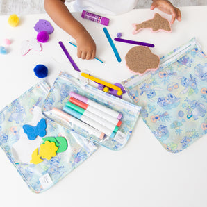 Kids crafting with markers as Bumkins Wet Bag + Clear Travel Bag 3 Pack: Disney Aloha Stitch keep supplies organized and tidy.