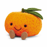 Jellycat Amuseables Clementine is a plush toy with a smiling face, brown legs, and green leaves by Jellycat.