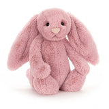The Jellycat Bashful Tulip Bunny Medium has a heart-shaped nose and soft nuzzly ears, sitting upright on a white background.