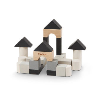 The Construction Set by PlanToys creates castle-like structures from sustainably made, black and natural wood toy blocks.