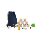 Storytelling Dice: 9 wood dice with blue & red illustrations, wood animal and accessory figurines, & navy blue pouch.