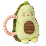 The Mary Meyer Yummy Avocado rattle is a plush toy with a smiling face, textured patch, pink-beaded handle & is machine washable.