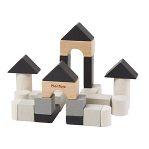 PlanToys Construction Set: Black, white & natural wood geometric blocks—cylinders, cubes, triangles. Sustainably crafted.