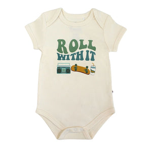 Emerson and Friends Luxury Bodysuit is in cream cotton, featuring ROLL WITH IT with images of a boombox, skateboard, and drink.