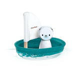PlanToys Sailing Boat, Polar Bear: Sustainable toy sailboat with a teal base, white sail, and polar bear figure floats on water.