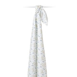 A Lulujo Inc. Cotton Swaddle, Koala design, elegantly drapes over a rod against a white backdrop.