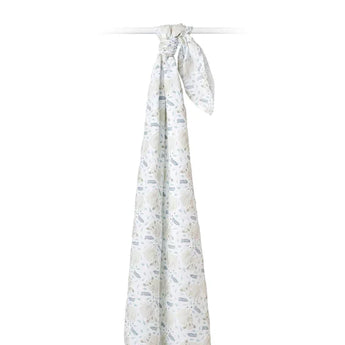 A Lulujo Inc. Cotton Swaddle, Koala design, elegantly drapes over a rod against a white backdrop.