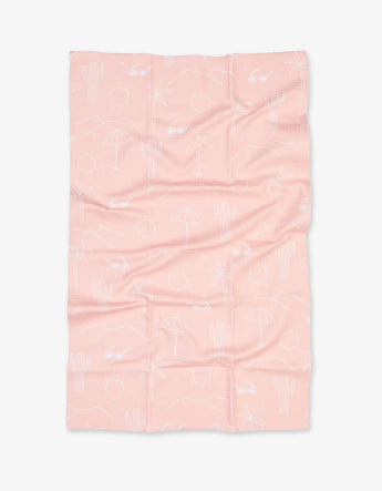 Geometry Tea Towels, Pink Paradise: pink microfiber waffle towels featuring white line drawings of cacti, umbrellas, suns & palm trees.