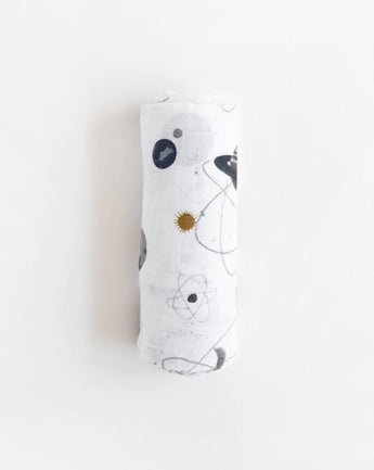 The Little Unicorn Cotton Swaddle, Planetary is a lightweight and breathable muslin adorned with planets and celestial designs.