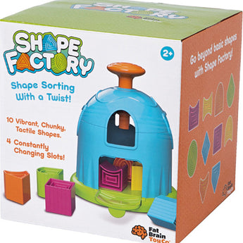 Box of Fat Brain Toy Cos Shape Factory includes colorful blocks and a shape-sorting puzzle for ages 2+ to enhance spatial skills.